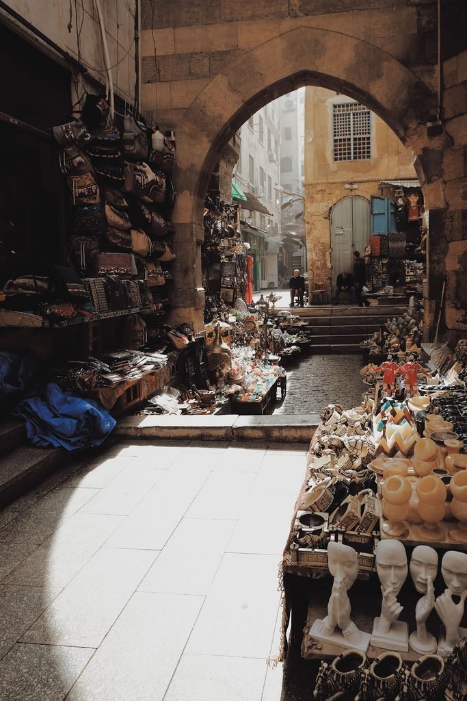 Narrow lantern-lit market street in the Khan el-Khalili bazaar, Cairo