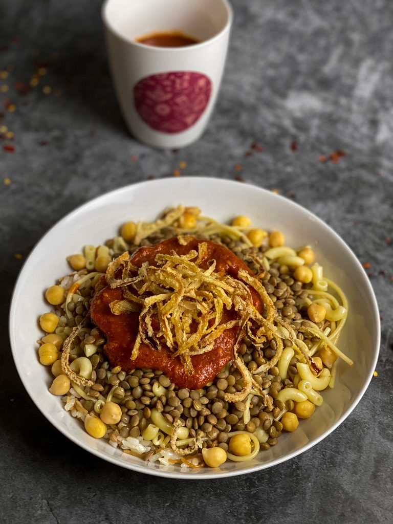 Close-up of a plate of koshari, Egypt's national street food dish of lentils, rice and pasta