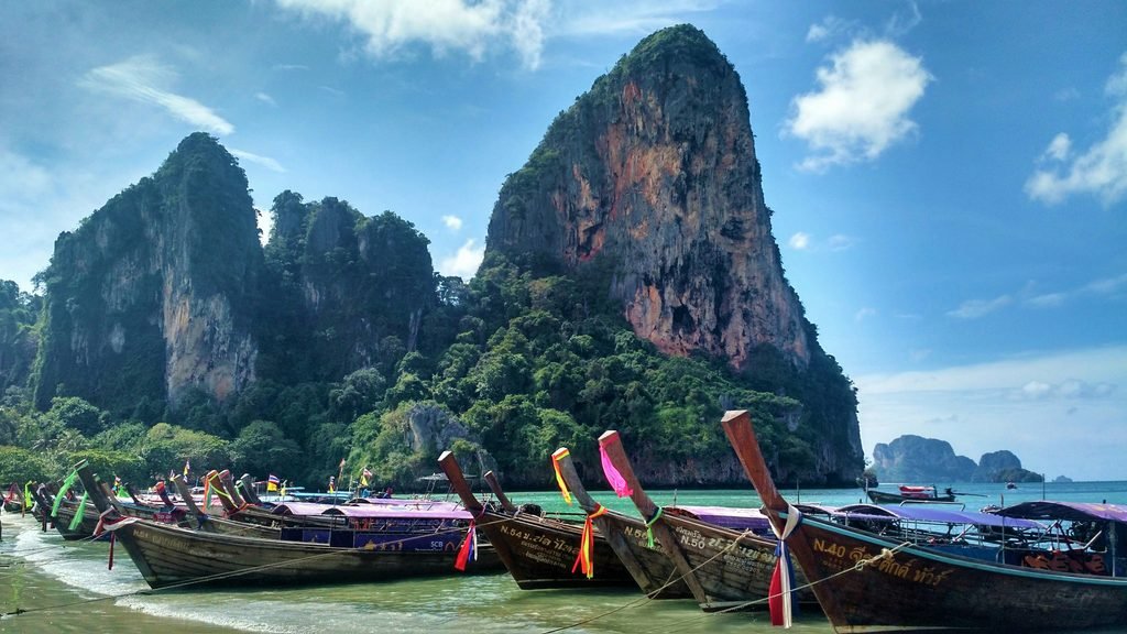 Limestone cliffs and longtail boats at Railay Beach, Krabi, Thailand